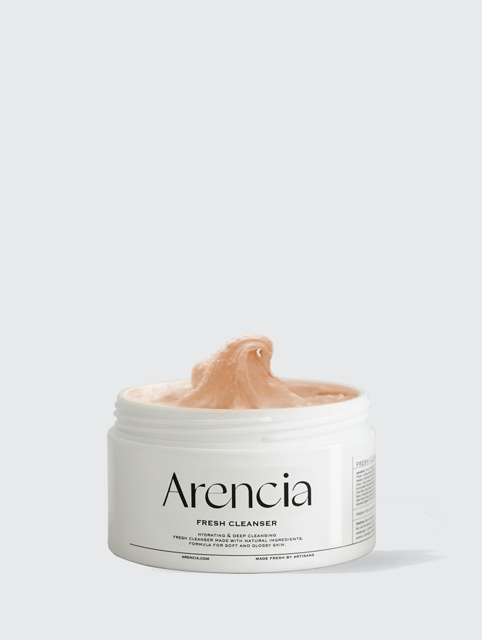 A jar of Arencia Fresh Cleanser, displaying its creamy texture emerging from the container, labeled for hydrating and deep cleansing with natural ingredients for soft and glossy skin
