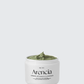 Arencia Green Artisan's Cleanser displaying its unique green texture. The jar is labeled clearly, highlighting its natural, moisturizing, and detoxifying properties, ideal for achieving smooth and glossy skin